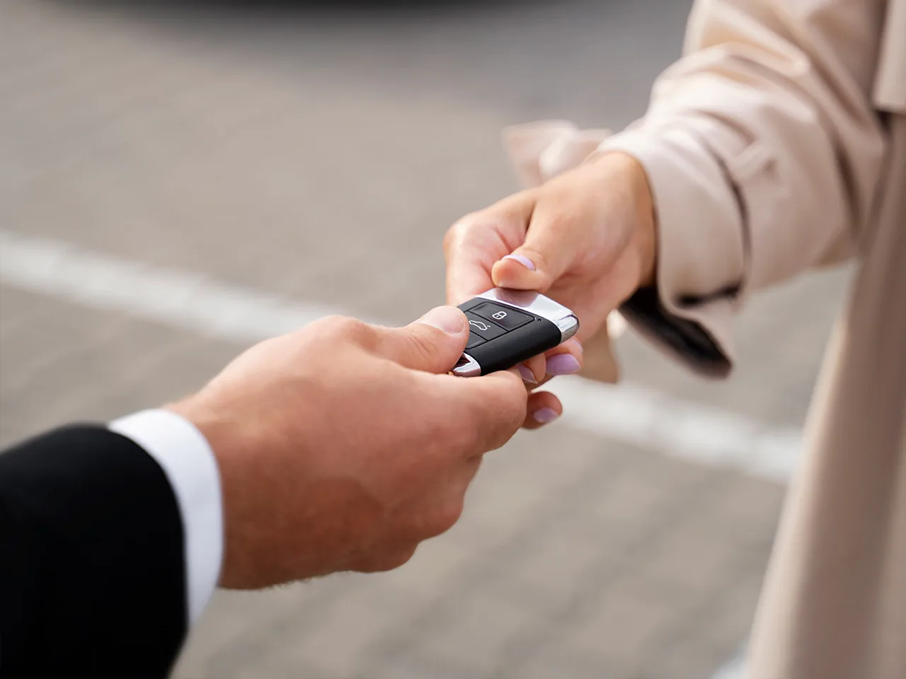 A key fob changing hands