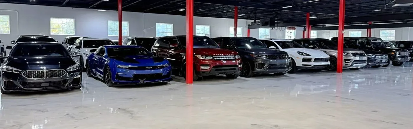 Inside the showroom, cars parked in rows